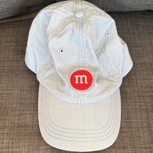 Blue Cap with Red M Logo